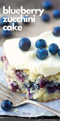 a blueberry zucchini cake with fresh lemon buttercream is on the table