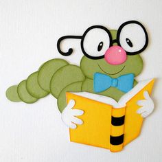 a green caterpillar reading a book with glasses and a bow tie on it's head