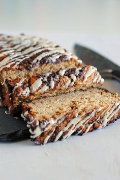 two slices of cake sitting on top of a plate next to a knife and fork