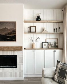 a living room filled with furniture and a fire place