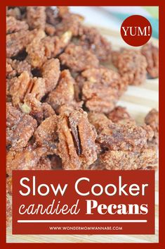 slow cooker candied pecans on a cutting board with text overlay that reads, slow cooker candies