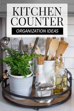 the kitchen counter is organized with plants and cooking utensils