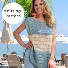 a woman standing on the beach with her hands on her hips wearing a knitted top