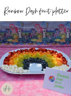 a rainbow dessert platter with marshmallows and fruit