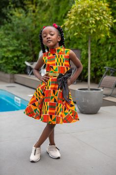 Our iconic Turtleneck style and our Sleeveless Turtleneck Midi Dress for Girls are precisely what you need when you want only the best for your Girls. Featuring a tulle underskirt for extra flare and a vibrant Ankara pattern, this African Print Dress for Girls is perfect for stylish culture representation at every occasion, including weddings, photoshoots & birthday parties! There's never a better reason to wear matching outfits with your family! Shop the rest of the collection HERE. FEATURES Tu Chitenge Dresses Classy, Chitenge Dresses, Ankara Pattern, Dress African Print, Tulle Underskirt, Turtleneck Midi Dress, High Neck Midi Dress, Turtleneck Style, African Children