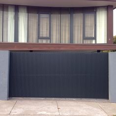 a house with an iron fence in front of it