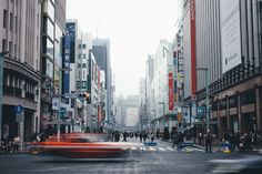 a city street filled with lots of tall buildings