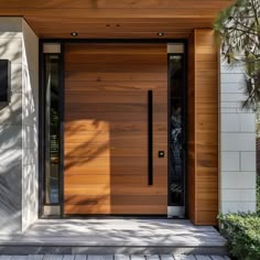 a modern wooden front door on a house