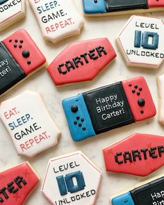 decorated cookies that say happy birthday to the game controller players and their name on them