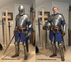 a man in armor standing next to a cross