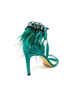 LIMITED EDITION Runs half size Large Details Color: Teal Heel height: 85 mm Heel / 3.35 inches Upper Material: Suede Suede Leaves detail and crystal-embellished Ostrich Feathers with Strass crystal rhinestones Round toe Beige leather insole Beige leather sole and rubber heel cap Padded insole makes these incredibly comfortable Country of Origin: Italy Description The “Maira“ stilettos, featuring delicately designed with feather and Strass crystal stones details adorning the Ankle lace-up, deliv Evening Sandals With Feather Trim And Ankle Strap, Feathered Open Toe Evening Sandals, Luxury Feather Trim Heels For Formal Occasions, Evening Open Toe Sandals With Feathers, Elegant Feather Trim Sandals For Summer, Elegant Summer Sandals With Feather Trim, Hand Embellished Heels For Party, Tennis Shoe Heels, Teal Heels