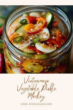 a glass jar filled with vegetables sitting on top of a table