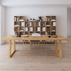 a wooden table sitting in front of a book shelf filled with books