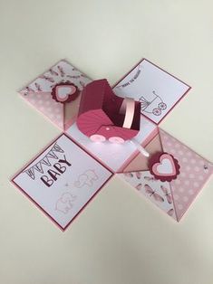 some pink and white greeting cards with hearts on the top one has a heart shaped box