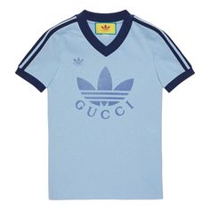 Gucci x adidas SS22 V-Neck T-Shirt 'Light Blue' 693636-XJEBZ-4709 Sporty Logo T-shirt For Sports, Blue Athleisure T-shirt With Three Stripes Branding, Blue T-shirt With Logo For Streetwear, Gucci T-shirt For Summer Streetwear, Sporty Light Blue T-shirt For Streetwear, Blue V-neck Athleisure Top, Casual Gucci Tops For Summer, Blue Sportswear T-shirt With Letter Print, Blue Sporty V-neck T-shirt