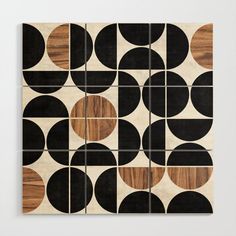 an art piece with black and brown circles on it