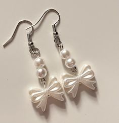 🤍coquette handmade beaded bow pearl drop earrings  coquette/acubi/cottagecore/fairycore aesthetic style length: ~2.5cm #coquette #beaded #bow #jewellery #jewelery #earrings #pearl #cottagecore #acubi #fairy #acubi #handmade #aesthetic Coquette Accessories Aesthetic, Cute Handmade Earrings, Coquette Wishlist, Ropa Coquette, Coquette Earrings, Coquette Accessories, Fairycore Earrings, Pearl Jewelry Earrings, Dream Magic