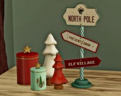 there is a sign that says north pole and presents next to it