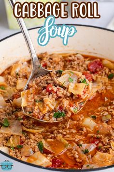 cabbage roll soup in a white pot with a ladle scooping up some food