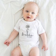 This adorable custom birth month flower baby romper will look so cute on your precious little one! Personalize it with your baby's name in Black Vinyl. Personalize with the birth month flower your baby was born and your new ones name.   PROCESSING TIME: This item is currently 3-5 business days from date of purchase SHIPPING: Processing time does not include shipping. Shipping is an additional 3-5 business day via USPS first class mail. PRODUCT POLICY: No returns, no exchanges, no cancellations unless a mistake is made on our part. We are not responsible for any spelling mistakes on information entered. Double check your spelling and information. Thanksgiving Baby Outfits, Fall Bodysuit, Baby Announcement Onesie, Spelling Mistakes, Christmas Bodysuit, Thanksgiving Baby, Simple Fall Outfits, Baby Christmas Outfit, Baby Must Haves