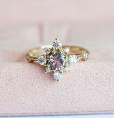 Listing is for sparkly and feminine champagne - peach sapphire diamond cluster ring. This ring is one of a kind and available in 14k yellow gold. Ring features 0.55 carat champagne - peach sapphire, top quality sapphire white diamonds - color G, VS clarity, total carat weight is 0.38 carat 14k solid yellow gold Please select size at the drop down menu. Processing time for this ring is 20 - 25 days. Ring will be shipped with DHL express shipping. ★ ★ ★ ★ ★ ★ ★ ★ ★ Enter my shop here: Click he... Peach Sapphire Rings, Peach Sapphire Engagement Ring, Color Change Sapphire, Vintage Inspired Engagement Rings, Peach Sapphire, Ring Cluster, Gold Pearl Ring, Future Engagement Rings, Sterling Silver Promise Rings