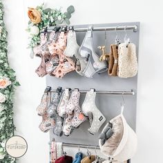 there are many baby booties hanging on the rack