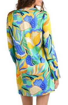 A vibrant tropical pattern emboldens this poolside cover-up topped with a laced-up neckline. Slips on over head Deep V-neck with ties Long sleeves Unlined 100% viscose Hand wash, line dry Imported Long Sleeve Tops For Pool And Spring, Floral Print Beachwear Tops For Pool, Floral Beachwear Tops, Summer Floral Print Top For Pool, Spring Beach Tie Neck Tops, Yellow Tops For Poolside Spring Season, Spring Tie Neck Top For Beach, Green Tops For Poolside Spring, Green Tops For Spring Poolside