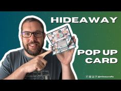 a man pointing at a card with the words hideaway in front of his face