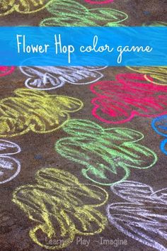 a sidewalk with colored chalks and the words flower hop color game written on it