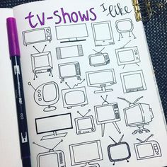 an open notebook with tv shows on it and a purple pen sitting next to it