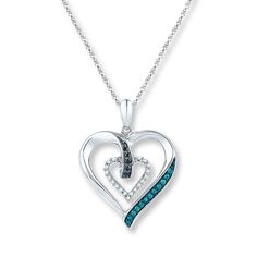 This romantic necklace features nestled hearts - one adorned with black and blue diamonds, the other traced in sparkling white diamonds. Styled in sterling silver with black and blue rhodium accents, the pendant has a total diamond weight of 1/6 carat and is suspended from an 18-inch rope chain that is secured with a spring ring clasp. Jared Diamond, Diamond Heart Necklace, Romantic Necklace, Blue Diamonds, Jewelry Advice, Heart Necklace Diamond, Black Necklace, Accessories Jewelry Necklace, Blue Diamond