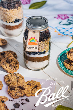 cookies and oatmeal in a jar on a table with the words welcome to ball