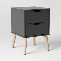 a black nightstand with two drawers and wooden legs