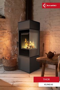 an image of a fireplace that is in the middle of a room with wood flooring