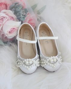 "Classic satin ballet flats with added oversized romantic lace embellished applique and create a vintage look. Great for comfort and perfect for flower girls or stylish princess. DETAILS: COLORS AVAILABLE: White, Ivory and Champagne UPPER: Synthetic upper and lining MATERIALS: Mandmade outsole ORIGIN: Imported STYLE NAME: FREEMAN Not sure of which size to purchase? Shoes measurements are as follow: (Please note measurements taken the length of inside of shoe from toe to heel) Walker: - Size 4: 5 Flower Girls Shoes, Communion Shoes, Satin Ballet Flats, Flower Girl Shoes, Romantic Lace, Mary Jane Flats, Flower Girls, White Satin, London Fashion