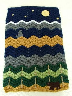 there is a crocheted blanket that looks like it has waves on the bottom