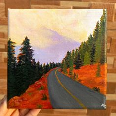 a painting of a road in the mountains with trees on both sides and an orange field to the side