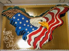 an eagle decorated with stars and stripes on top of a cake