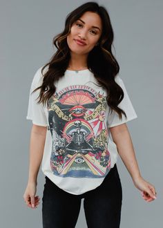 This women's graphic tee adds edgy, colorful style to summer or spring outfits. With its multicolored skull and rock & roll graphic, it's perfect for expressing your bold personality. Dress up with accessories for a unique and stylish look.  White short sleeve graphic tee Multicolored Rock & Roll graphic on the front Short sleeves Imported garment Designed in the U.S.A. Produced in China. Black And White Graphic Tee, Graphic Tee Women, Knitted Hats Kids, Black And White Graphic, White Graphic Tee, Pre Black Friday, Long Jumpsuits, Rock Roll, Men's Knit