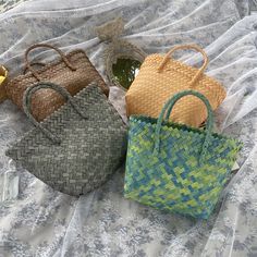 This Basket Rattan Woven Bag Handbag is handcrafted using traditional techniques for a high-quality and durable design. Made from 100% natural rattan, this bag is eco-friendly and biodegradable. The timeless design is perfect for adding a touch of bohemian charm to any outfit, while the sturdy construction ensures it can hold all your essentials. Handcrafted from natural rattan, our Basket Rattan Woven Bag Handbag is a timeless accessory. This eco-friendly bag is both durable and stylish, with intricate woven details. Perfect for everyday use or a day at the beach, this bag is a must-have for any fashion-forward and environmentally-conscious individual. Shopping Bag Storage, Geometric Blanket, Tote Beach Bag, Basket Tote, Woven Handbags, Bucket Bags, Eco Friendly Bags, Handbags Casual, Woman Weaving