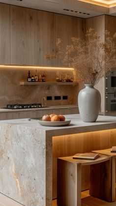 a modern kitchen with an island countertop and built in shelves on the wall behind it