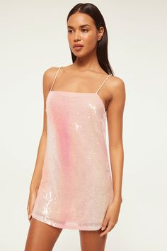 Our new Aline mini dress is a sparkling Summer stunner. Cut from a glittering pink ombré sequin stretch fabric, this short shift features a straight neckline with adjustable spaghetti straps and v backline with a strap across. Slightly sheer. Lined. Pair this 90's inspired dress with everything from flat sandals to strappy heels. Made in the USADry Clean95% Polyester 5% Spandex Model Measurements: Height 5'9", Waist 24.5, Bust 32, Hips 35Model is wearing size XS Ombre Sequin Dress, Pink Sequin Spaghetti Strap Dress, Pink Ombre Sequin Dress, Pink Sheer Sleeveless Mini Dress, Multicolor Sequined Sleeveless Mini Dress, Short Pj Set, Aline Dress, Long Sleeve Jersey, White Party