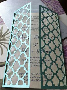 two different colored wedding cards on top of each other