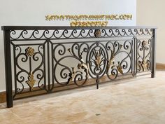 an ornate iron fence in the corner of a room