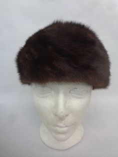 BEAUTIFUL AND STYLISH CANADIAN DARK RANCH MINK FUR HAT FOR WOMEN! THIS HAT IS PRE-OWNED: THE FUR AND THE INSIDE LINING ARE "EXCELLENT", THE BEST CONDITION  POSSIBLE! SIZE: 22"   AFTER THE PURCHASE, PLEASE LET US KNOW YOUR HEAD CIRCUMFERENCE INCLUDING THE TIP OF YOUR EARS AND WE WILL ADJUST THE HAT ACCORDINGLY, BEFORE SHIPPING, IF NEEDED AND FREE OF CHARGE!      A9623 Oliverfurs 9250 Parc Ave. #204, Montreal, Quebec, H2N 1Z2, Canada www.oliverfurswholesale.com oliver@oliverfurswholesale.com Toll free: 1-866-845-9997 International: 1-514-845-9997 Formal Brown Winter Hats, Winter Brown Flat Brim Cloche Hat, Brown Flat Brim Cloche Hat For Winter, Brown Mini Hat With Short Brim For Winter, Classic Brown Cloche Hat, Winter Formal Cap Hat, Formal Winter Cap Hat, Formal Winter Cap, Cap Women