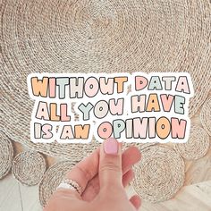 someone holding up a sticker that says without data all you have is an opinion