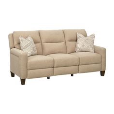 a beige couch with two pillows on it