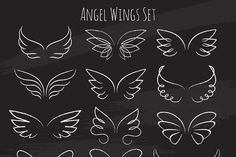 an angel wings set drawn in chalk on a blackboard