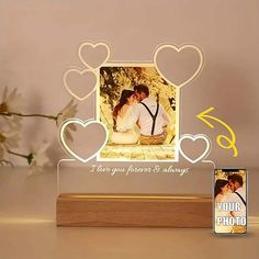 a photo frame with two hearts on it