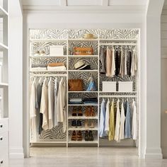 an organized closet with clothes, shoes and handbags on the shelves in front of it